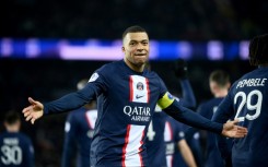 Kylian Mbappe celebrates after netting his 201st goal for PSG against Nantes to become the club's all-time top scorer