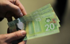 File: A wad of Canadian dollars. AFP/Nicholas Kamm