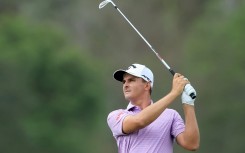 Christiaan Bezuidenhout of South Africa shared the lead with Canada's Adam Svensson at the Players Championship before play was stopped early due to an incoming storm