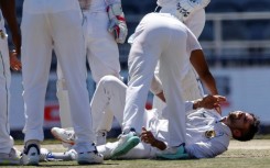Keshav Maharaj (R) injured himself while celebrating the dismissal of Kyle Mayers