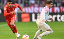 Bayern's Joao Cancelo runs at Augsburg's Mads Pedersen