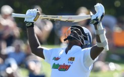 A classy century from Angelo Mathews kept Sri Lanka's World Championship hopes alive in the first Test against New Zealand
