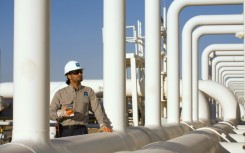 A handout picture provided by Energy giant Saudi Aramco, Saudi Arabia's Oil Company, shows one of its engineers at Yanbu refinery on January 16, 2011 