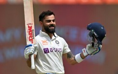 India's Virat Kohli celebrates after scoring his first century since November 2019 on the fourth day of the fourth Test against Australia in Ahmedabad on Sunday