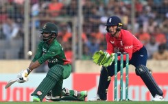 Bangladesh's Towhid Hridoy plays a shot as England's wicketkeeper captain Jos Buttler watches
