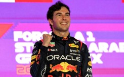 Sergio Perez celebrates on the podium after winning the Saudi Arabia Grand Prix