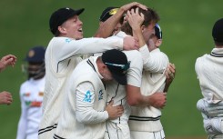 New Zealand players celebrate the wicket of Sri Lanka's Nishan Madushka on their way to winning the second Test on Monday in Wellington