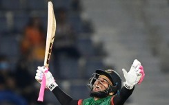 Bangladesh batsman Mushfiqur Rahim  celebrates after scoring a century in the second one-day international against Ireland in Sylhet. The home side made 349-6, their highest ODI score, but the match was called off because of rain