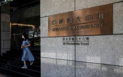 A woman leaves the China Evergrande Centre in Hong Kong on in July 2022