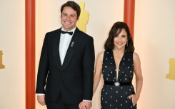 US actress Julia Louis-Dreyfus and her son Henry Hall attend the 2023 Oscars 