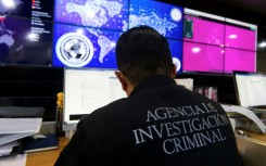 Agents from Mexico's Criminal Investigation Agency monitor people smugglers' social media accounts 