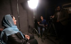 An Iraqi woman shares memories of what she endured under the Islamic State group, during a filmed interview with members of the Mosul Eye project