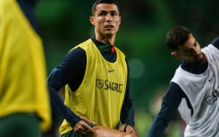 Record-breaker: Cristiano Ronaldo warms up ahead of the match between Portugal and Liechtenstein