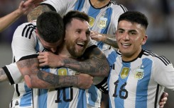 Lionel Messi (centre) and his world champion Argentina team-mates celebrate his goal against Panama on a night of festivities in Buenos Aires