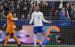 Kylian Mbappe celebrates after scoring one of his two goals in France's 4-0 win over the Netherlands in Euro 2024 qualifying on Friday