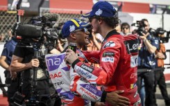 Top team: Francesco Bagnaia greets second-placed  Ducati teammate Jorge Martin