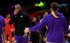 LeBron James and Austin Reaves of the Los Angeles Lakers warm up ahead of the game against Chicago