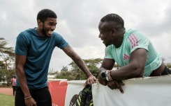 Sharry Dodin (L) soaks up the advice from Commonwealth 100m champion Ferdinand Omanyala after training in Nairobi