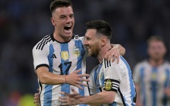 Superstar Lionel Messi (right) celebrates a goal with Argentina teammate Giovani Lo Celso during the thrashing of Curaco