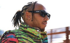 Mercedes' driver Lewis Hamilton arrives at the Australian Grand Prix