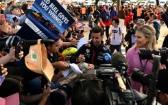 Red Bull reserve driver Daniel Ricciardo signs autographs in Melbourne