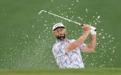 Spain's third-ranked Jon Rahm plays a bunker shot during a practice round ahead of the 87th Masters at Augusta National
