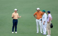 Rory McIlroy talks with Brooks Koepka, who plays in the upstart LIV Golf League, during practice on Tuesday for this week's Masters tournament at Augusta National