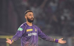 Kolkata's Varun Chakravarthy celebrates the first of his four Bangalore wickets 