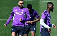 Karim Benzema (L) scored a hat-trick against Barcelona in the Clasico and Carlo Ancelotti thinks he will stay at Madrid