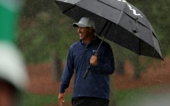 Brooks Koepka held a four-stroke lead at the Masters before rain stopped third-round play on Saturday