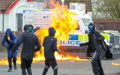 Masked youths pelted police vehicles with projectiles, including petrol bombs following a march to commemorate the 1916 Easter Rising Londonderry 