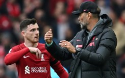 Liverpool defender Andrew Robertson talks to Reds boss Jurgen Klopp