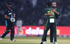 Pakistan skipper Babar Azam hugs Faheem Ashraf who had just dismissed Daryl Mitchell 