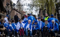 Thousands of people from around the world take part in the annual event at the site of the former death camp built by Nazi Germany after it invaded Poland