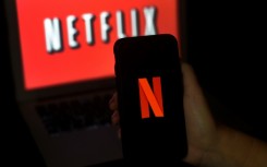 Netflix says its new ad-subsidized subscription tier is starting out better than expected, and that it will begin a broad rollout of paid plans for people who share passwords with other households
