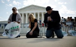 Anti-abortion activists pray outside the US Supreme Court