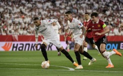 Youssef En-Nesyri (L) fires Sevilla ahead as Harry Maguire, who gave the ball away, chases in vain