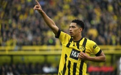Dortmund's English midfielder Jude Bellingham celebrates scoring his team's first goal in a 4-0 demolition of Frankfurt on Saturday