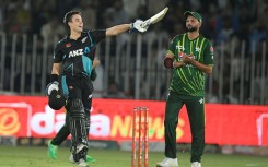 New Zealand's Mark Chapman (L) celebrates after scoring a century