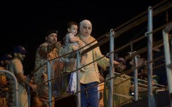 Nearly 200 people from more than 20 countries disembarked from a naval frigate in the Saudi city of Jeddah Monday night after a daring escape from Sudan