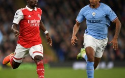 Manchester City defender Manuel Akanji (R)