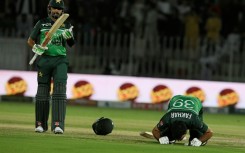 Moment of celebration: Pakistan's Fakhar Zaman (right) celebrates after scoring his century on Thursday