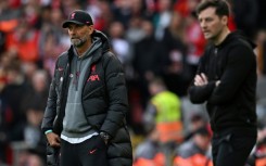 Jurgen Klopp (left) watches his Liverpool players against Tottenham