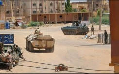 Sudanese Army soldiers and armoured vehicle in southern Khartoum on May 6, 2023