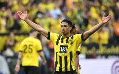 Triumphant: England midfielder Jude Bellingham celebrates scoring in Borussia Dortmund's 6-0 win over Wolfsburg