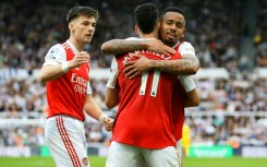 Arsenal kept the Premier League title race alive by winning at Newcastle