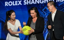 Officials sign an oversized tennis ball at a launch ceremony for the 2023 Shanghai Masters tournament