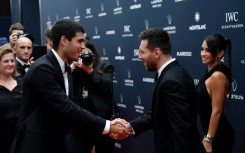 Lionel Messi meets another Laureus award winner Carlos Alcaraz (left) 