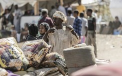 People who fled Sudan for Ethiopia have their belongings security checked in Metema 