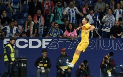 Barcelona's Polish forward Robert Lewandowski celebrates scoring the opening goal against Espanyol as his side won La Liga